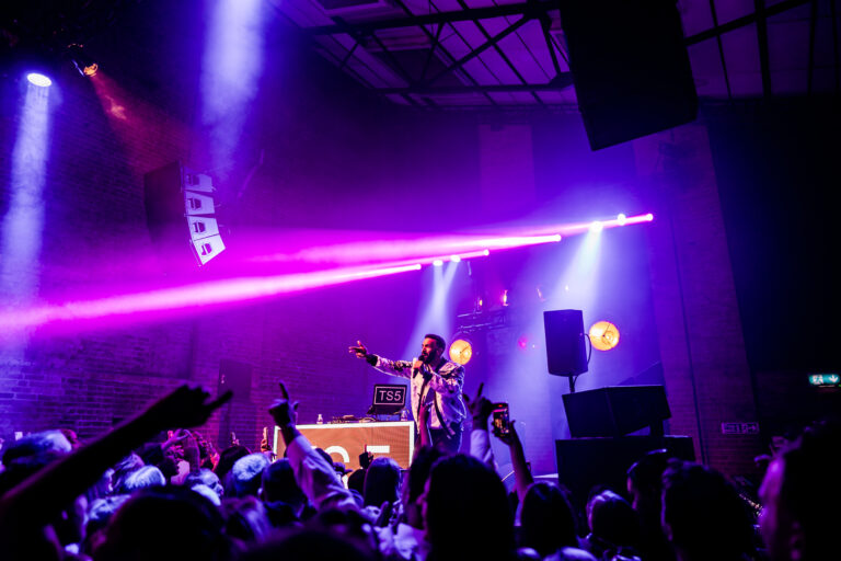 Craig David singing infront of LED videowall DJ booth