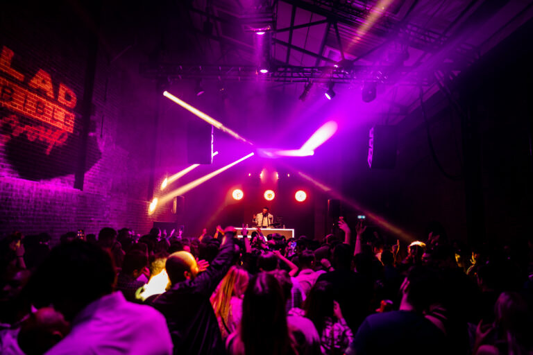 Venue and crowd with purple lighting setup