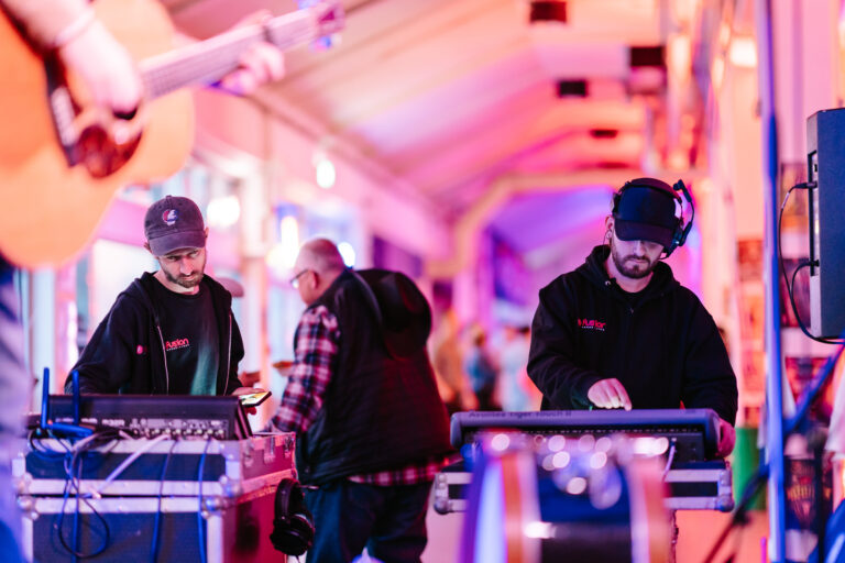 Sound engineers with mixing desks
