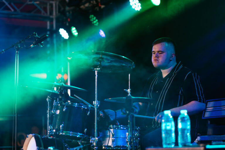 Drummer with stage lighting