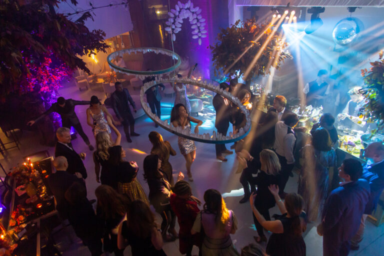 Live band performing on dancefloor light by pinspots and cool uplighting