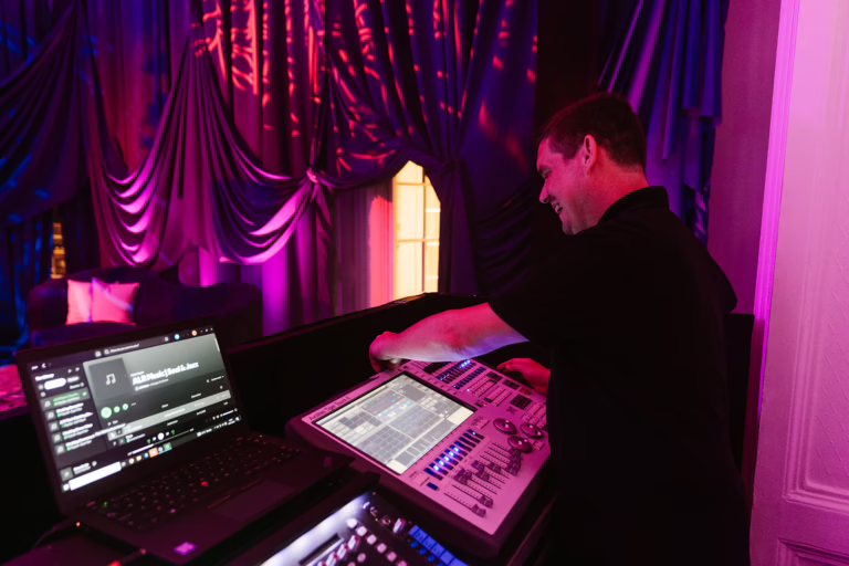 Lighting engineer programming the lights for jazz band