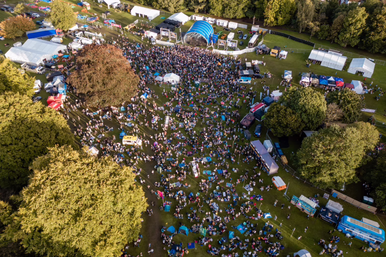 Aerial view of crowd by main stage (daytime)